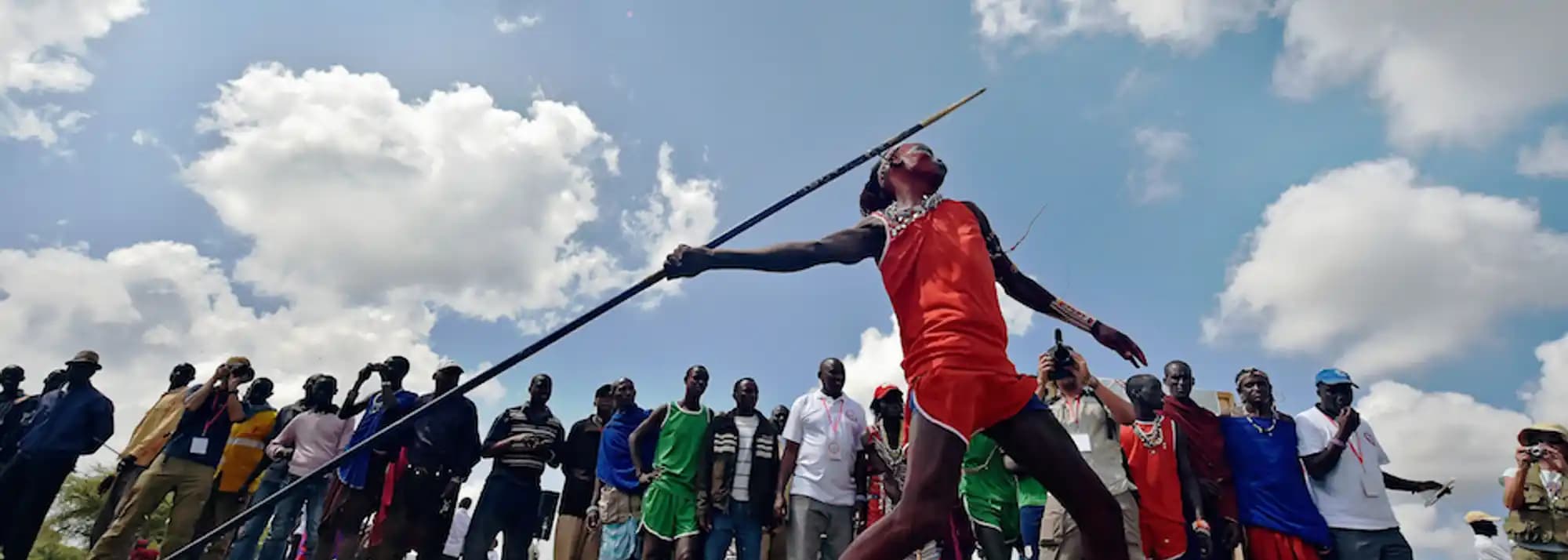 Maasai men jumping high in a traditional ceremony.